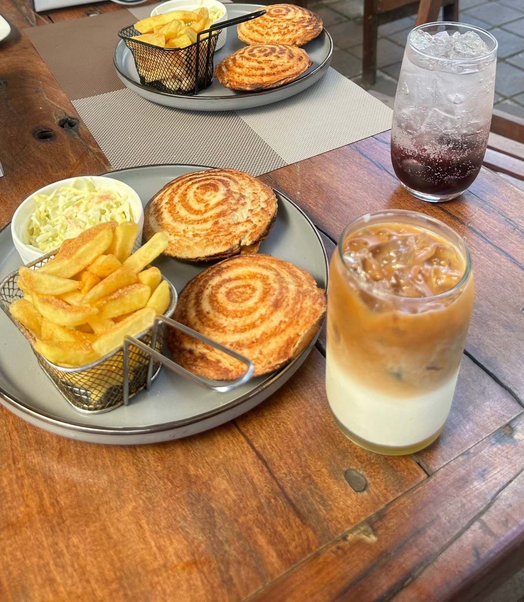 Toasted sandwiches with chips and an iced coffee latte